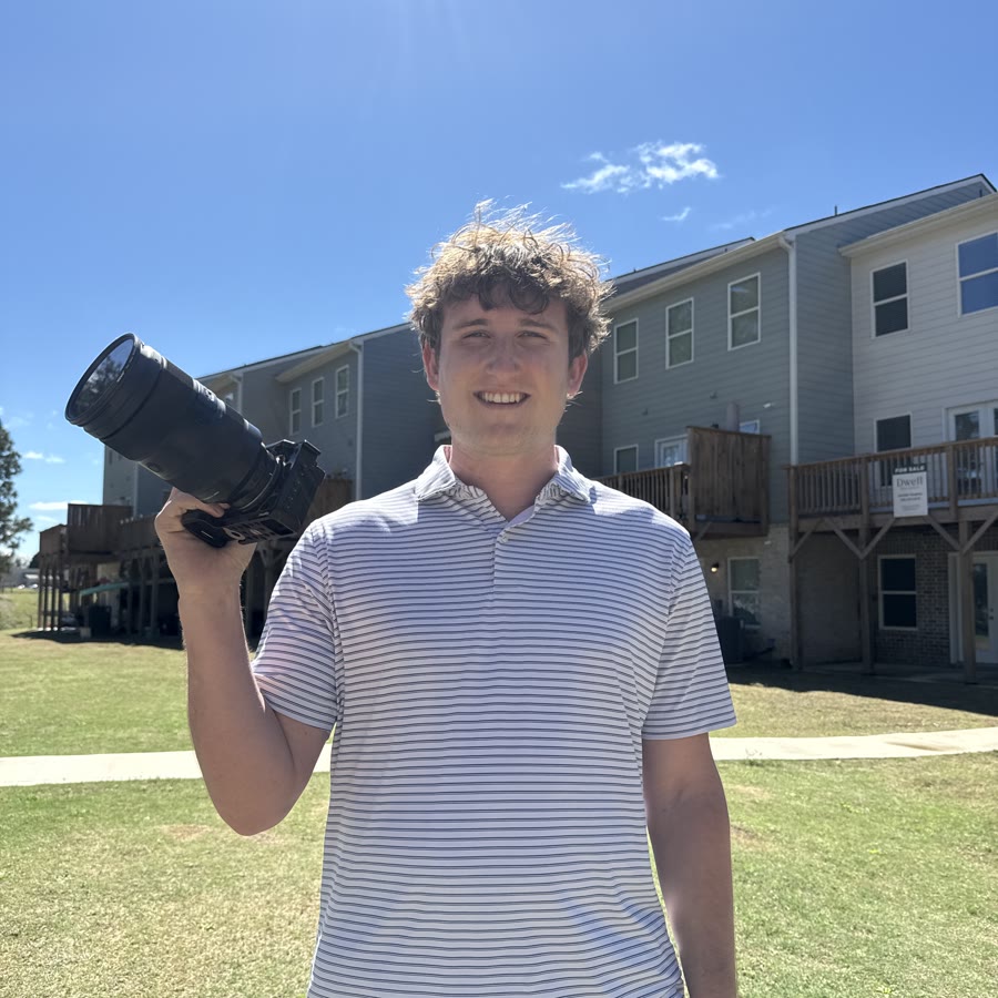 Patrick, holding his camera
